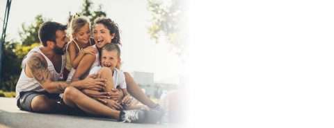 Happy family enjoying outdoor activities, representing family dental care at North County Cosmetic and Implant Dentistry in Vista, CA