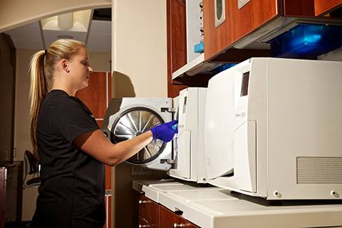 Dental technician crafting CEREC same-day crowns at North County Cosmetic and Implant Dentistry in Vista, CA